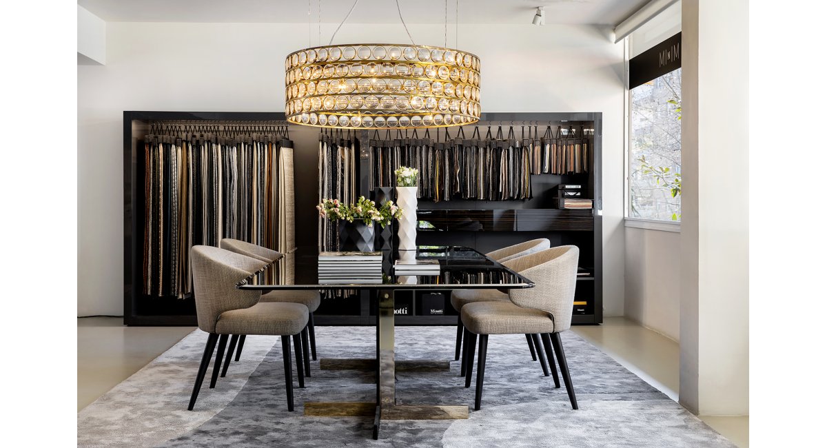 Mesa de cristal Catling Dining con sillones Aston Dining de Minotti en MINIM Barcelona